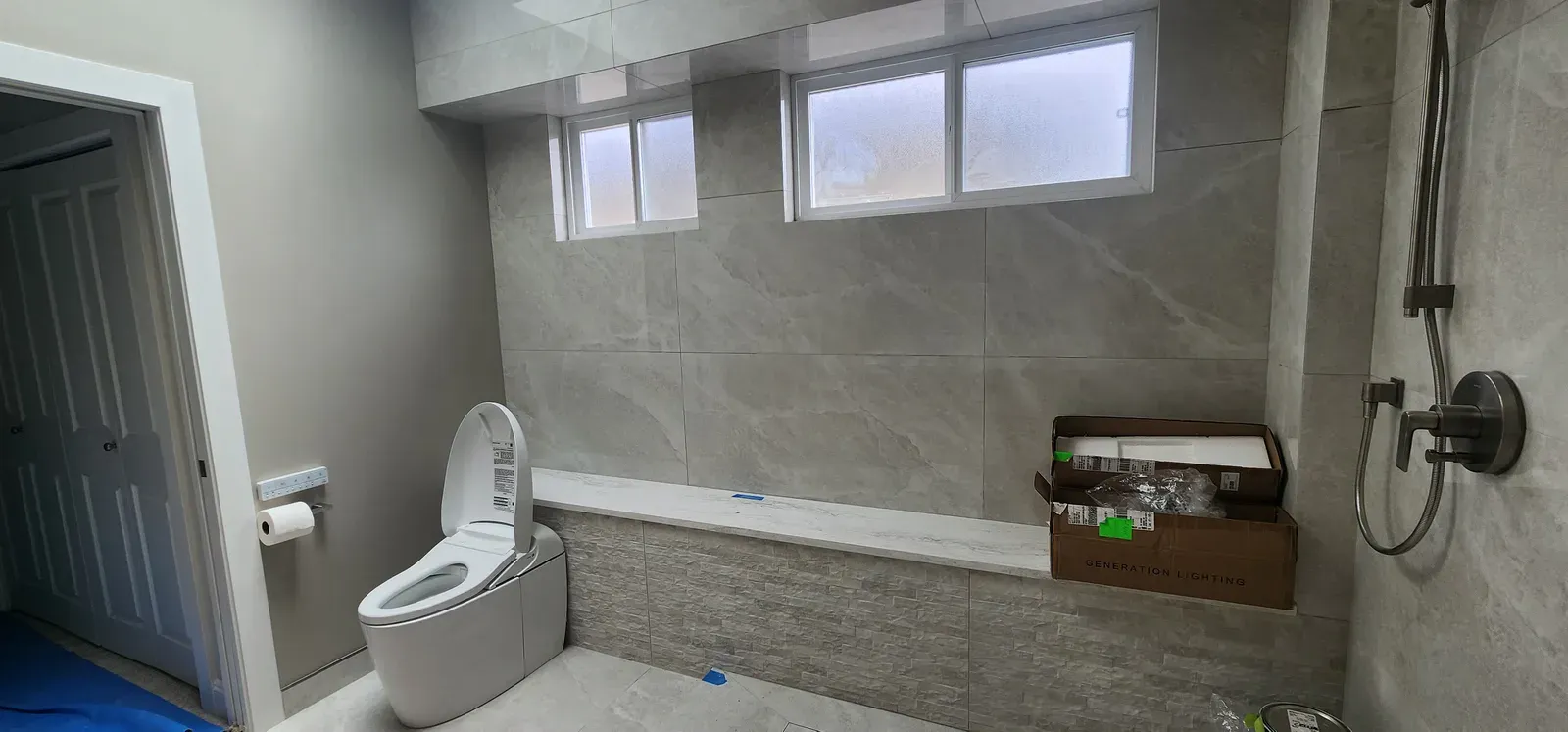 Contemporary large-format bathroom completed by RENOGUYS