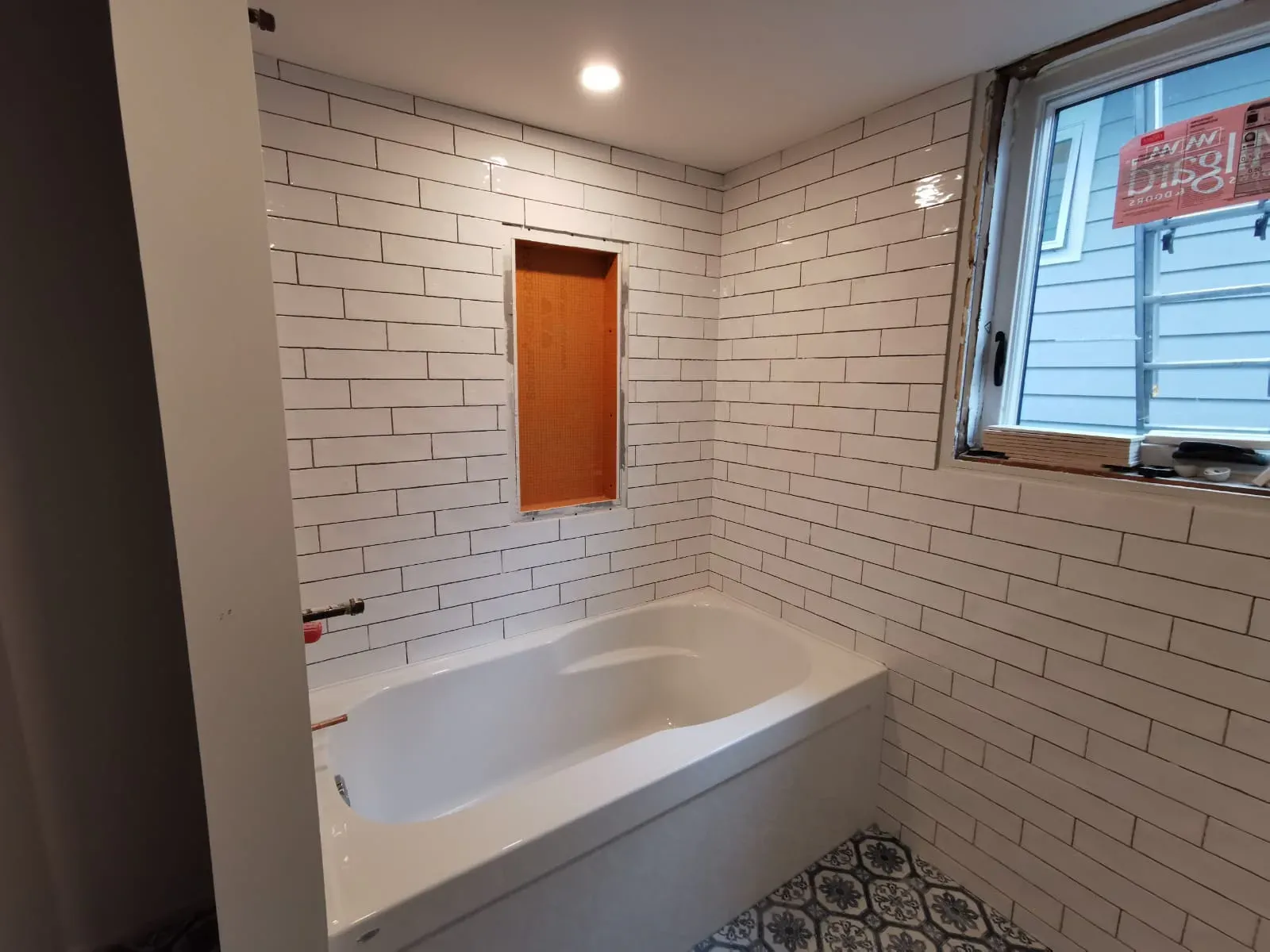 White Subway Tile Bathroom installed by RENOGUYS