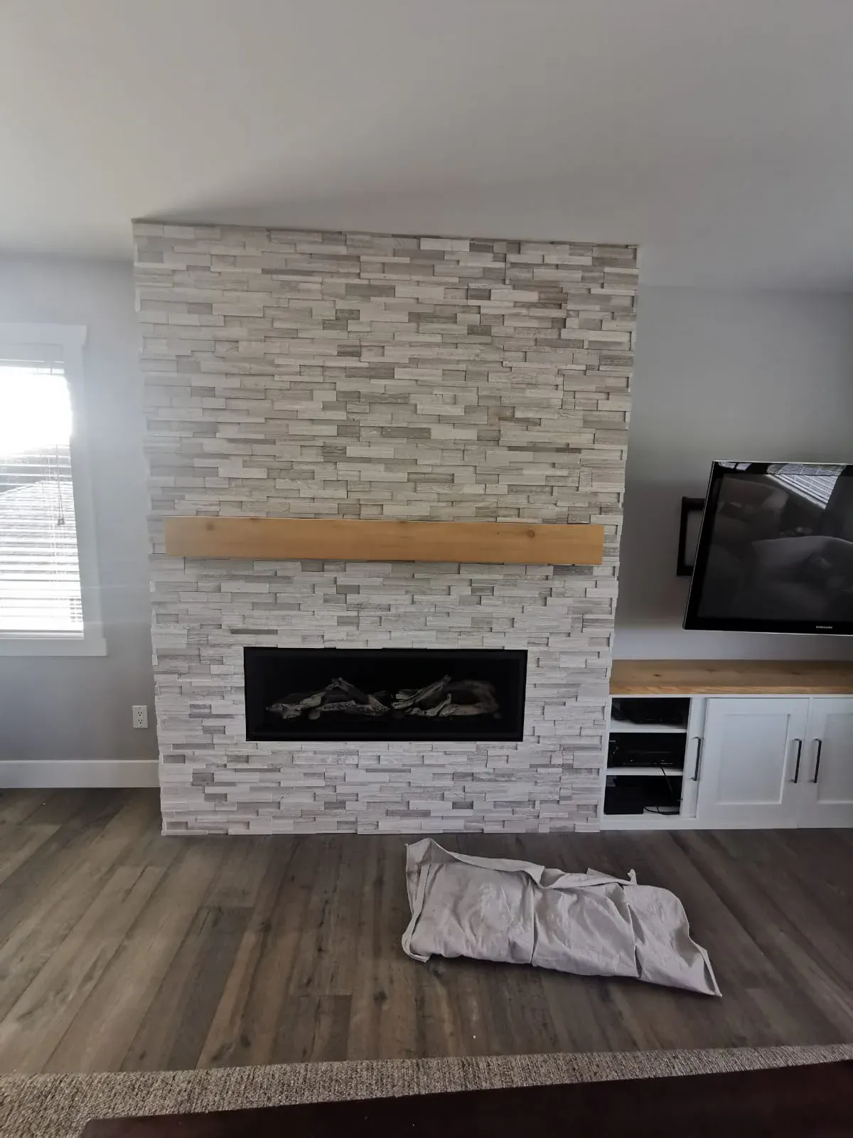 Stacked Stone Fireplace installed by RENOGUYS