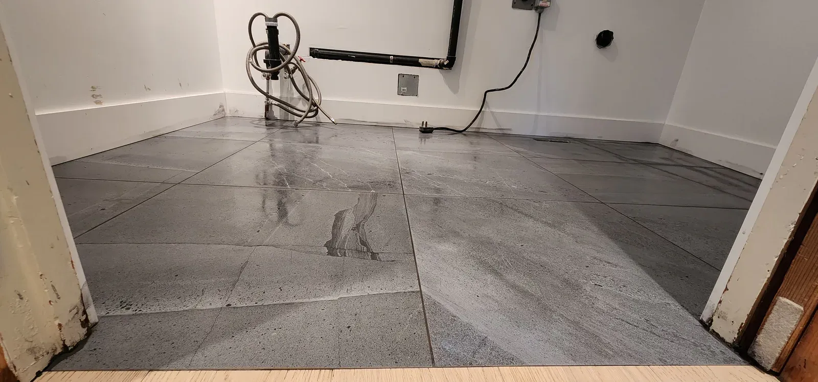 Marble-look bathroom renovation completed by RENOGUYS
